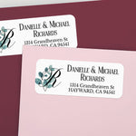 Close-up of personalized return address label with leafy eucalyptus watercolor accent and bold serif font for names and address - XOXOKristen