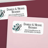 Close-up of personalized return address label with leafy eucalyptus watercolor accent and bold serif font for names and address - XOXOKristen