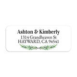 Close-up of return address label featuring realistic pine branch greenery and bold black text on a crisp white background - XOXOKristen