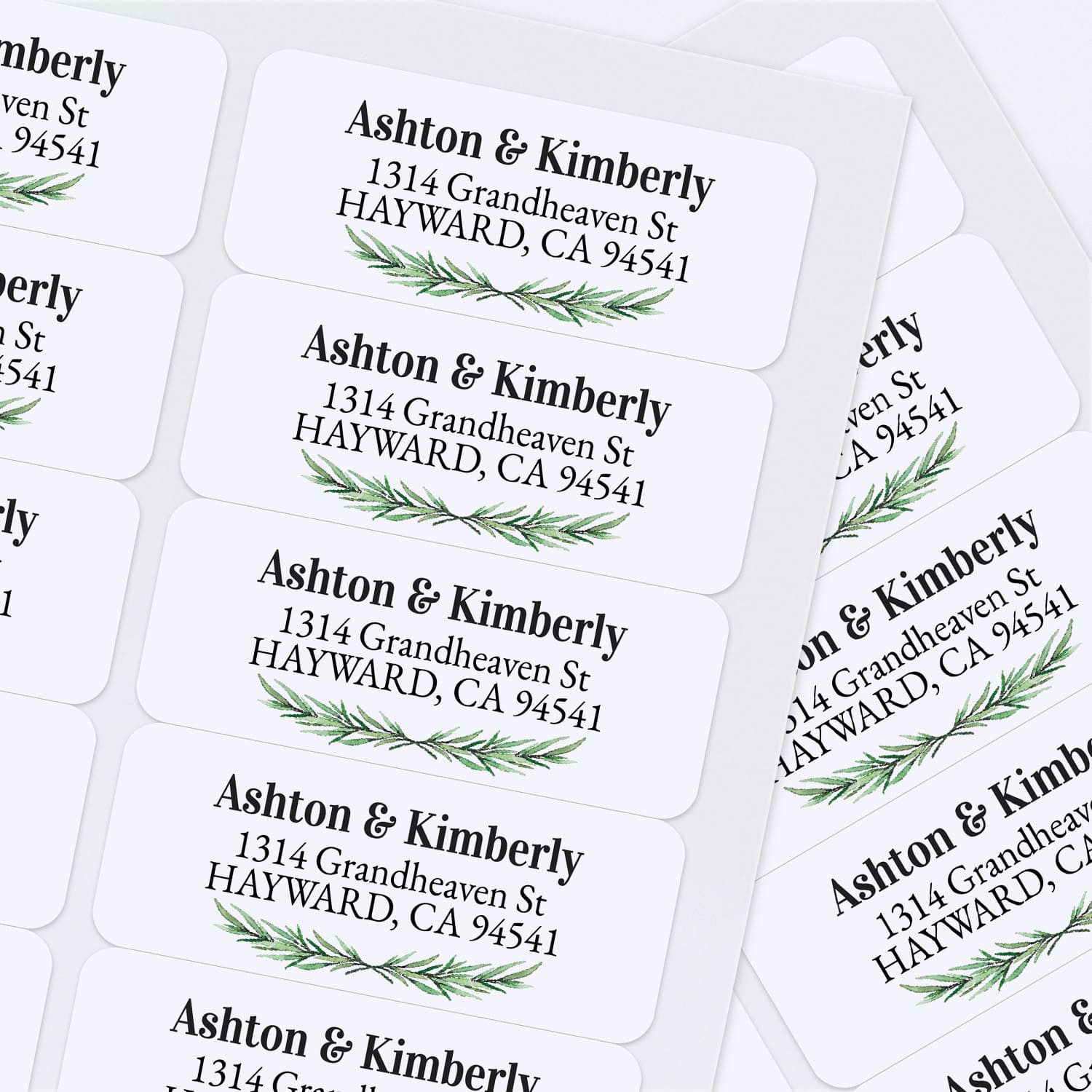 Sheet of personalized pine-themed return address stickers with green botanical accents and formal typography, ideal for weddings and holiday mailings - XOXOKristen