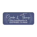 Close-up of custom navy return address label with laurel leaves framing elegant white script typography, printed on rectangular sticker - XOXOKristen