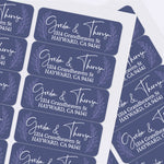 Sheet of navy personalized address labels with laurel leaf accents and stylish calligraphy font, perfect for weddings and everyday mailing - XOXOKristen