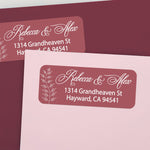 Custom return address labels on pink and burgundy envelopes, featuring burgundy background with floral vine accents and elegant white text - XOXOKristen