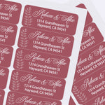 Sheet of custom printed burgundy address labels with botanical accents and stylish script font, perfect for weddings and special occasions - XOXOKristen