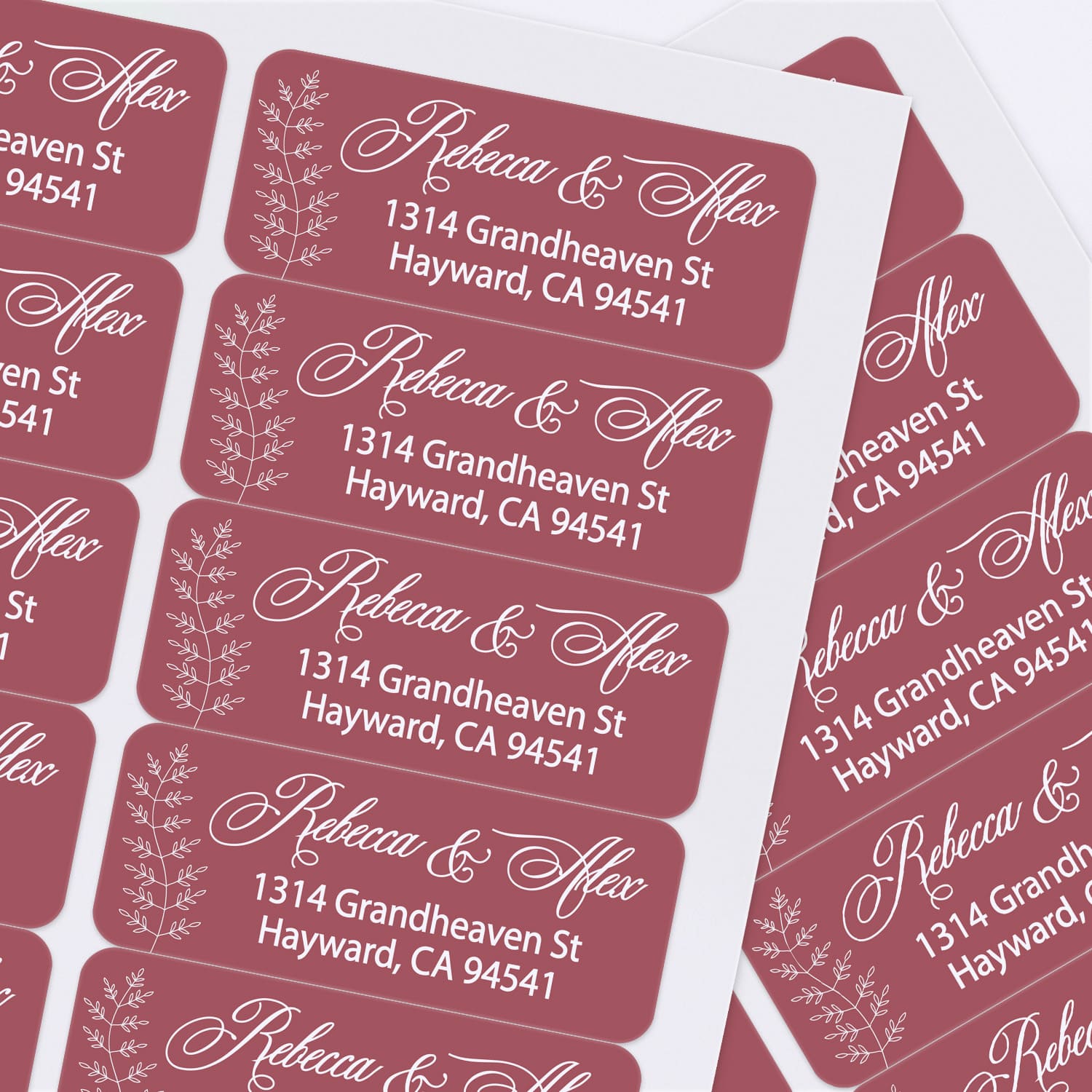 Sheet of custom printed burgundy address labels with botanical accents and stylish script font, perfect for weddings and special occasions - XOXOKristen
