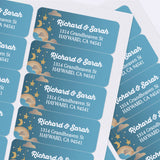 Sheet of custom printed address labels with teal blue background, hanging stars, moon, clouds, and bold white text for mailing - XOXOKristen