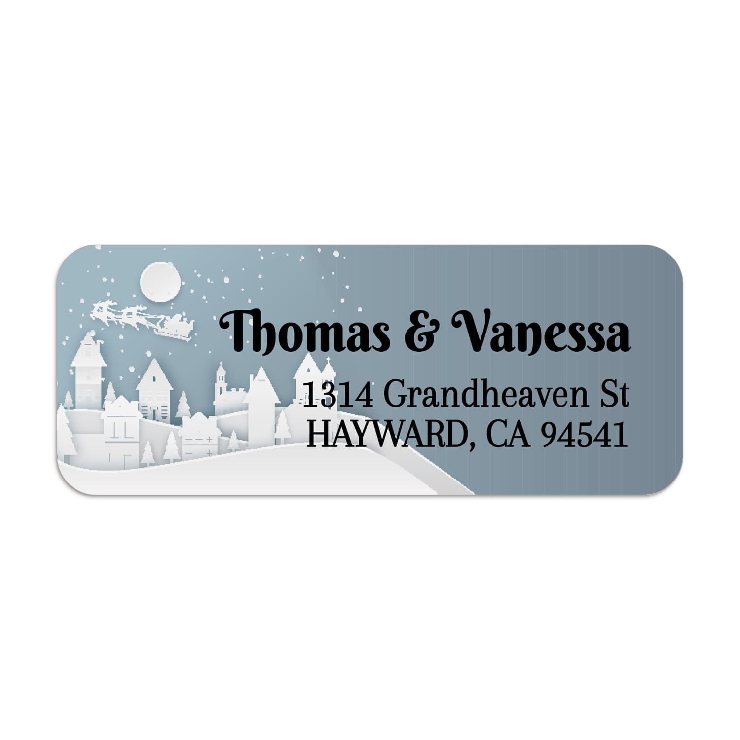 Close-up of winter village return address label with white cut-out style buildings, snowflakes, and bold printed text - XOXOKristen