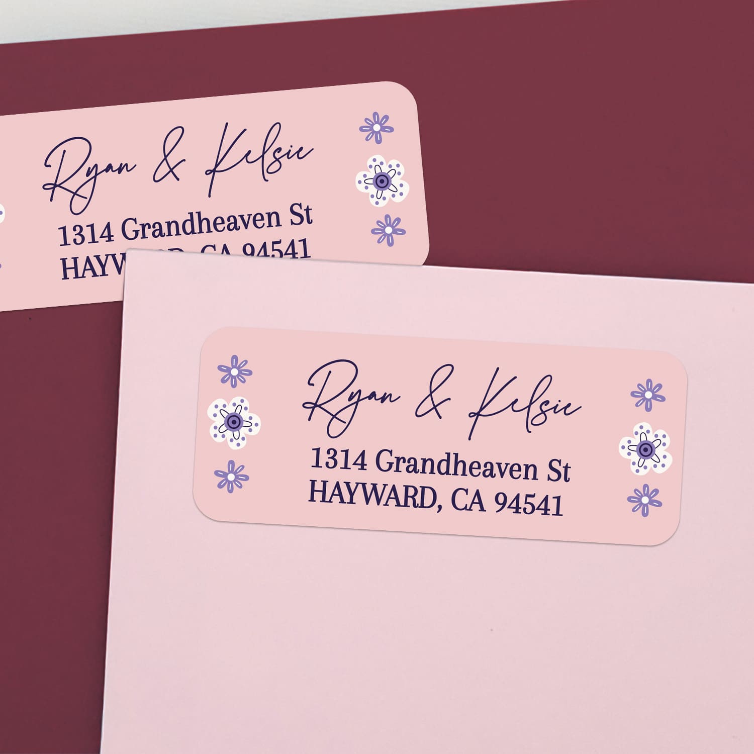 Custom return address stickers on pink and burgundy envelopes, featuring blush background with playful purple flower motifs and elegant text - XOXOKristen