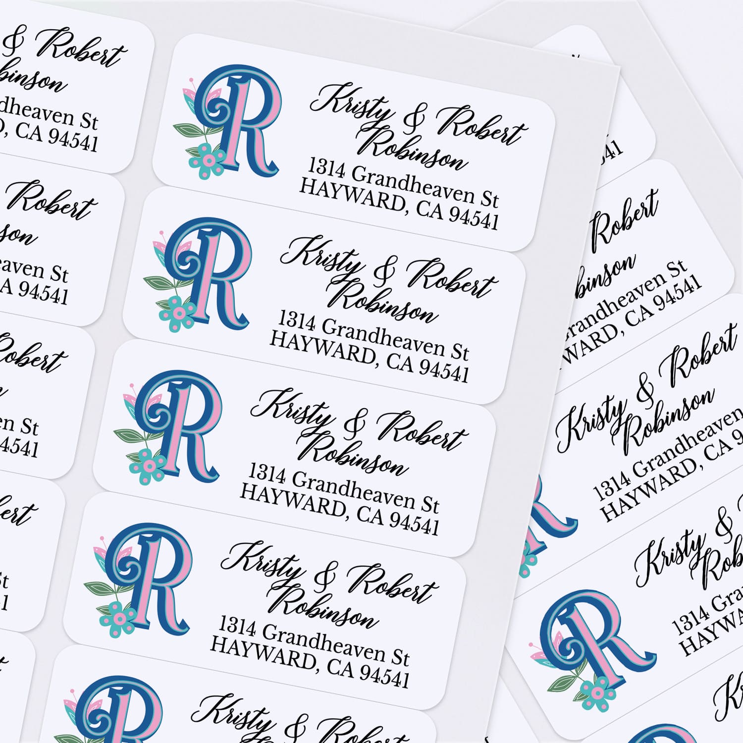 Custom floral monogram address label with decorative custom initial, leaves, and pink flower on white adhesive paper - XOXOKristen