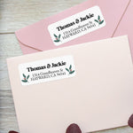 Close-up of holly berry return address label featuring traditional green leaves and red berries with bold black font - XOXOKristen