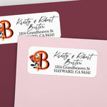 Custom return address label on pink and burgundy envelopes, featuring decorative orange monogram with flower illustration and elegant calligraphy text - XOXOKristen