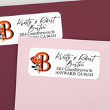 Custom return address label on pink and burgundy envelopes, featuring decorative orange monogram with flower illustration and elegant calligraphy text - XOXOKristen