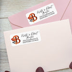 Personalized rectangular address label sticker with bold orange floral monogram initial and modern script typography on white background - XOXOKristen
