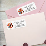Personalized rectangular address label sticker with bold orange floral monogram initial and modern script typography on white background - XOXOKristen