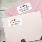 Return address label with floral accents styled on pink envelope for wedding stationery or personal use — XOXOKristen.