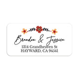 Rectangular return address label with floral border of red and yellow flowers, featuring modern black script for names and serif text for address, on white background — XOXOKristen.