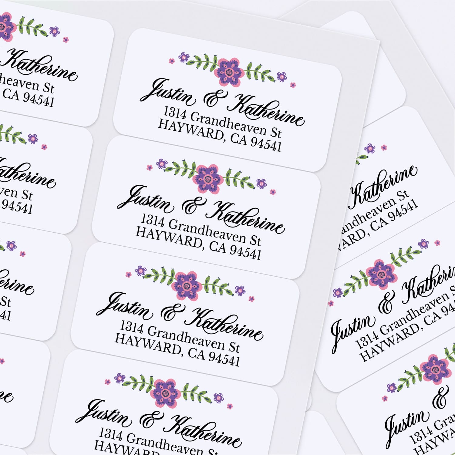Custom floral return address label with elegant black script and serif font, displayed on light envelopes - XOXOKristen