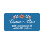 Personalized floral return address label with orange blossom and leaves on bold blue background, custom white script lettering on envelope - XOXOKristen