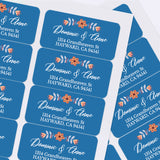Custom return address label with floral motif in orange and white on blue background, elegant typography on mailing envelope - XOXOKristen