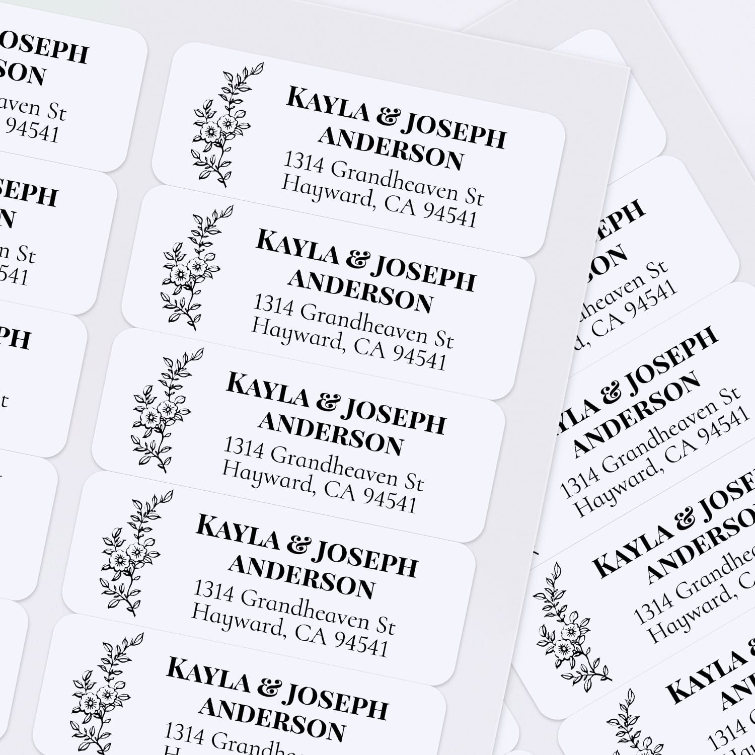 XOXOKristen sheet of multiple black and white floral return address labels with simple botanical line drawing and classic serif font - XOXOKristen