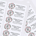 XOXOKristen sheet of multiple personalized floral wreath return address labels with leafy greenery, soft pink blossoms, and monogram detail - XOXOKristen