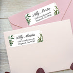 XOXOKristen custom greenery address labels on pastel pink envelopes, featuring watercolor leaves and modern script typography - XOXOKristen