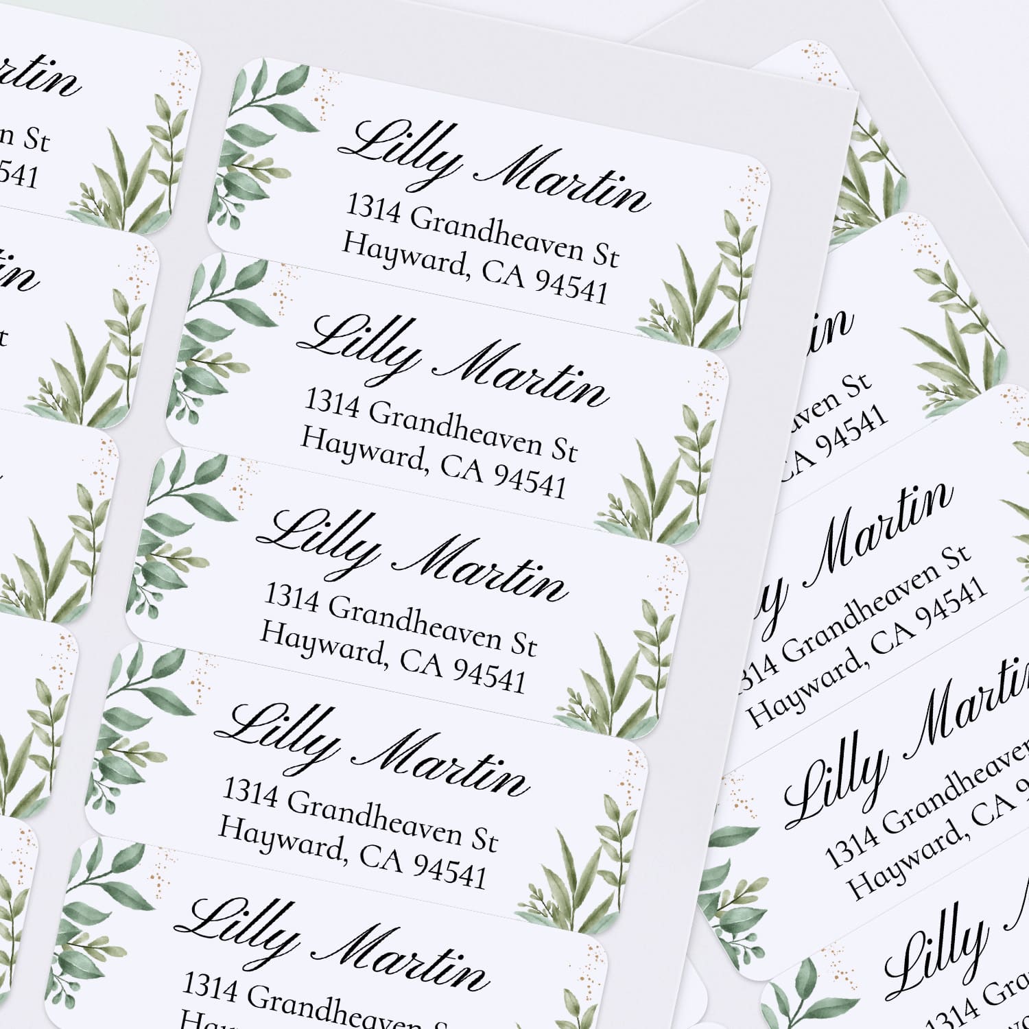 XOXOKristen sheet of multiple personalized greenery return address labels with white background, watercolor foliage, and black lettering - XOXOKristen