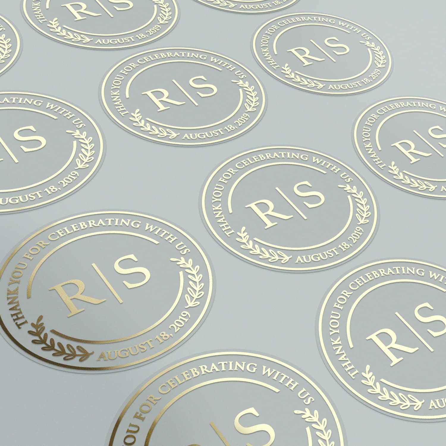 XOXOKristen clear round wedding stickers with foiled monogram, displayed in sheets, customizable labels for save the date, favors, and bridal showers