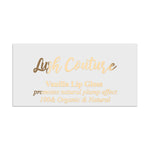 Rectangular branding label in metallic gold foil, combining flowing script headline with fine serif subtext – XOXOKristen.