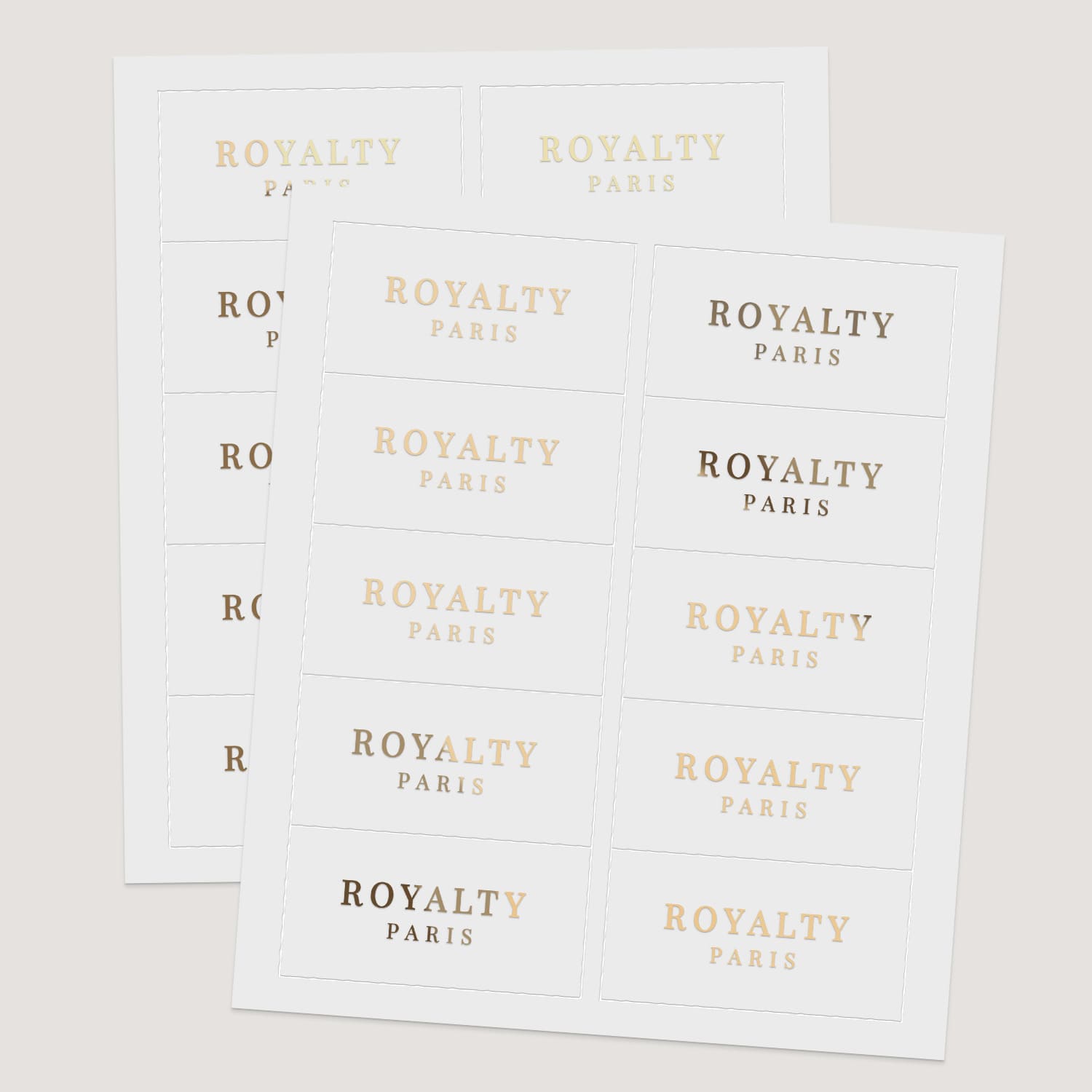 Sheets of rectangular branding labels with uppercase serif typography in metallic foils and black print, minimalist design – XOXOKristen.