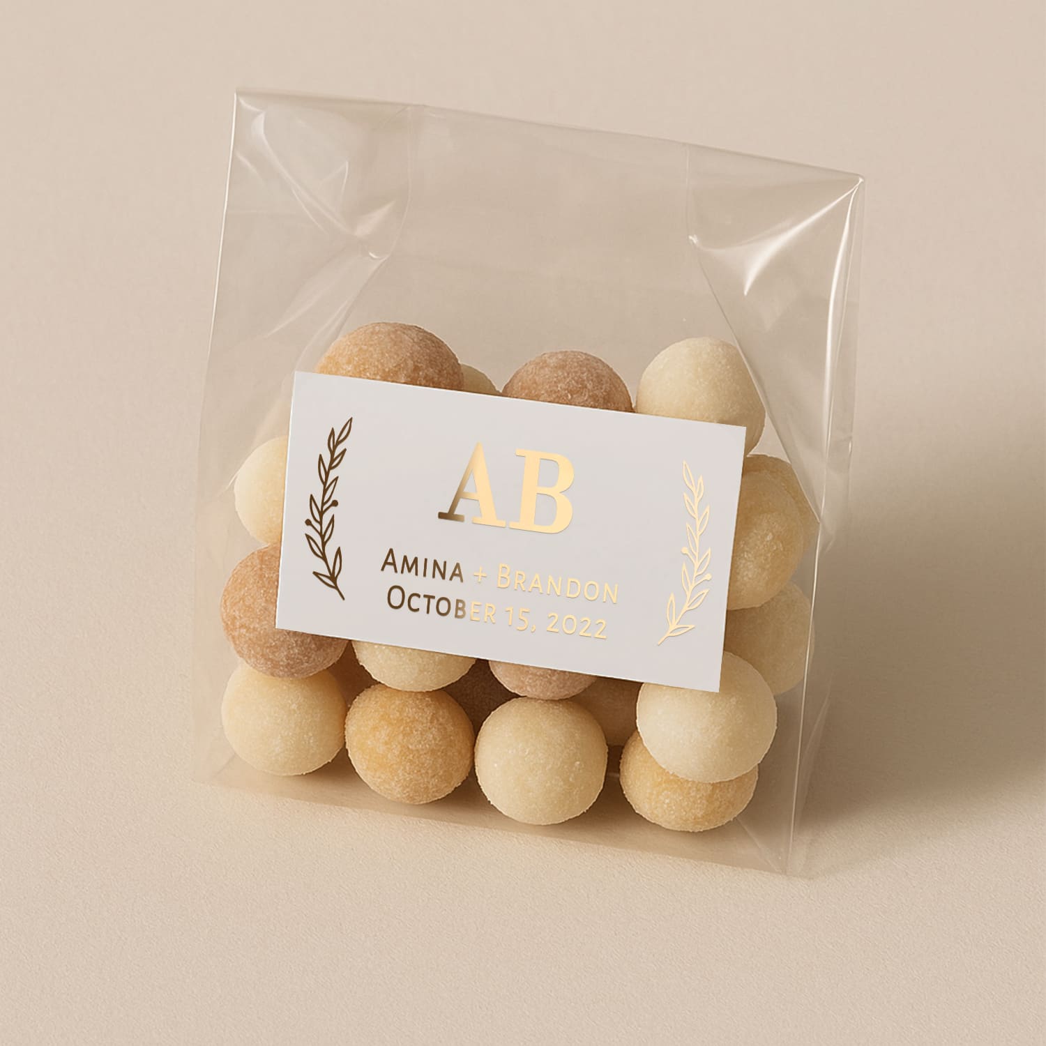 Custom Personalized White matt small rectangular wedding favors sticker with gold foil print - bride and groom mongrams, names and wedding date alongside floral leafs from both sides - XOXOKristen