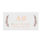 Rectangular wedding favor label in rose gold foil, featuring elegant serif initials framed by botanical foliage illustrations – XOXOKristen.