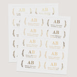 Sheets of rectangular wedding stickers in metallic foils and black print, all featuring bold serif initials with botanical sprig accents – XOXOKristen.