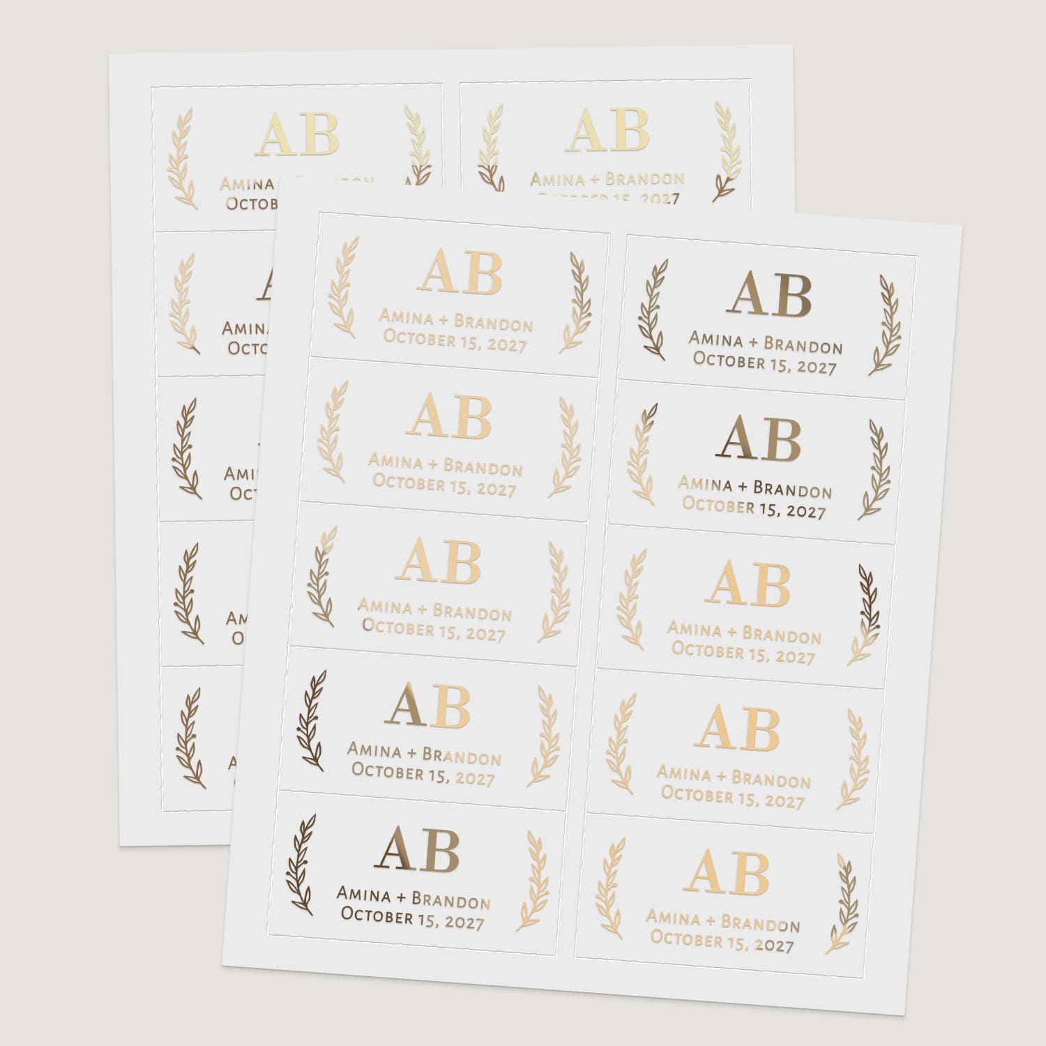 Sheets of rectangular wedding stickers in metallic foils and black print, all featuring bold serif initials with botanical sprig accents – XOXOKristen.