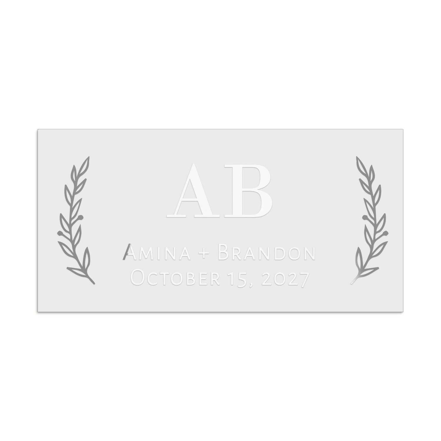 Rectangular wedding favor sticker in silver foil, designed with central serif initials framed by elegant botanical sprigs – XOXOKristen.