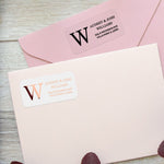 XOXOKristen custom address labels in black ink and rose gold foil on clear vinyl, used as envelope seal stickers for weddings and special events - XOXOKristen