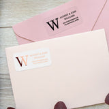 XOXOKristen custom address labels in black ink and rose gold foil on clear vinyl, used as envelope seal stickers for weddings and special events - XOXOKristen