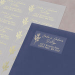 Elegant rectangular address label with floral botanical motif, personalized text in luxurious gold foil, applied to dark navy envelope - XOXOKristen