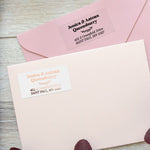 XOXOKristen return address label stickers with black and blush pink print, applied on pink and cream envelopes, elegant personalized mailing labels - XOXOKristen