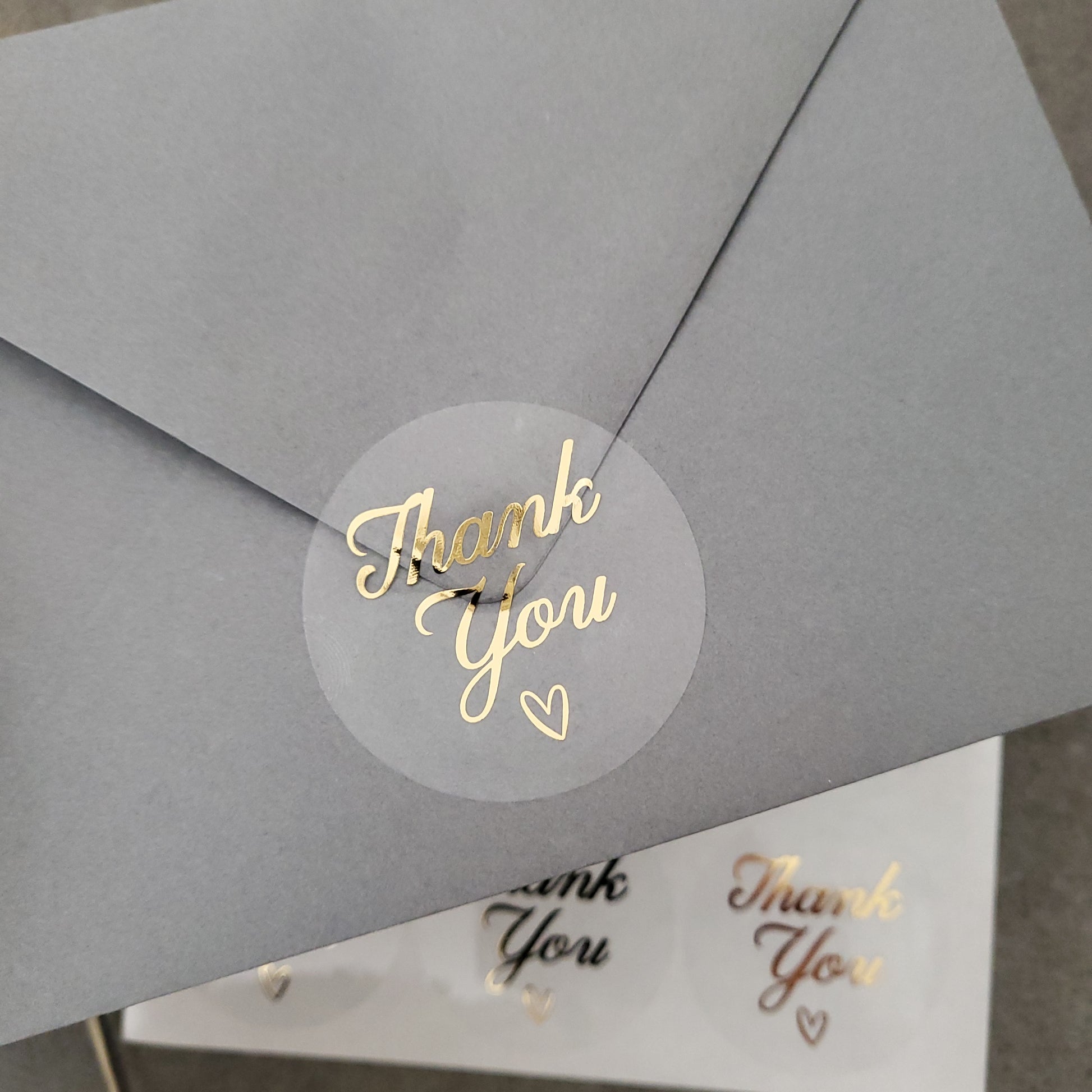 gold foiled thank you labels with little heart on a clear sticker - XOXOKristen