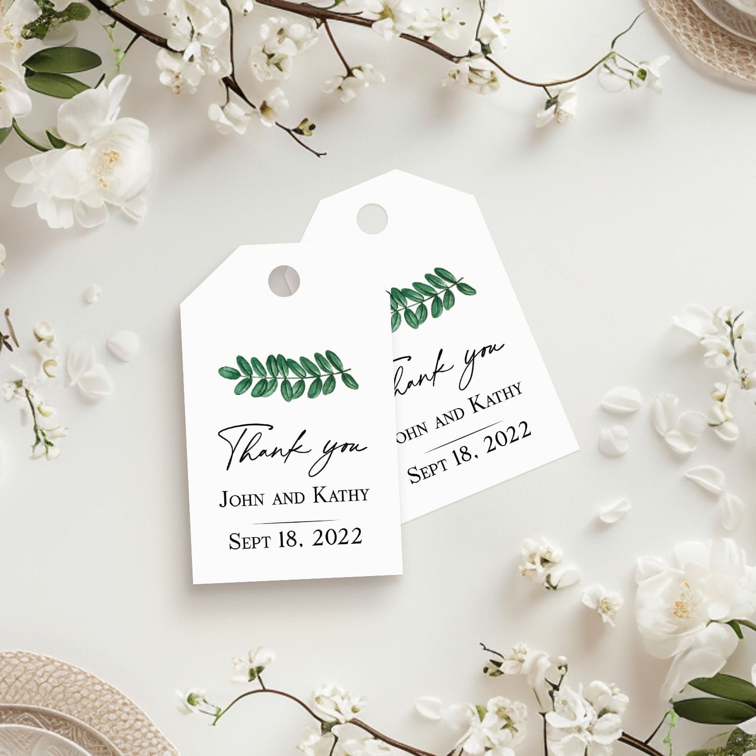 XOXOKristen Green Leaf Thank You Tags featuring a watercolor branch of green leaves above elegant printed text reading “Thank you.” Perfect for personalized wedding favors and natural-themed packaging.