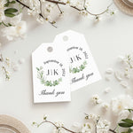 XOXOKristen Greenery Thank You Tags featuring a delicate watercolor wreath of eucalyptus and soft greenery surrounding printed initials and the static text “Thank you.” Perfect for personalized wedding favors and nature-inspired packaging.