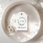 XOXOKristen Eucalyptus Thank You Tags tied with natural twine onto a linen favor bag, showing the delicate printed “Thank you” text below the greenery wreath for a rustic botanical presentation.