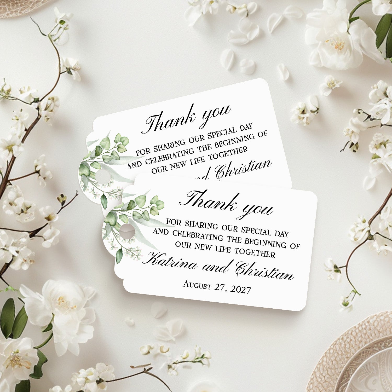 XOXOKristen Greenery Wedding Thank You Tag placed on soft beige fabric — minimalist botanical design, personalized and custom tag for weddings.