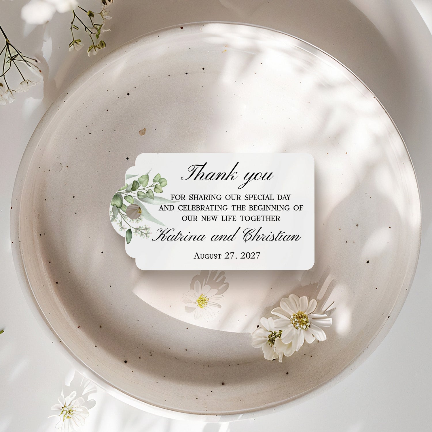 XOXOKristen Greenery Wedding Thank You Tag placed on soft beige fabric — minimalist botanical design, personalized and custom tag for weddings.
