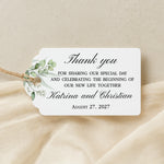XOXOKristen Greenery Wedding Thank You Tag placed on soft beige fabric — minimalist botanical design, personalized and custom tag for weddings.