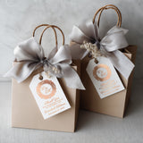 XOXOKristen Monogram Thank You Tags printed in rose gold foil with intricate baroque monogram and elegant text — personalized and custom wedding tags.