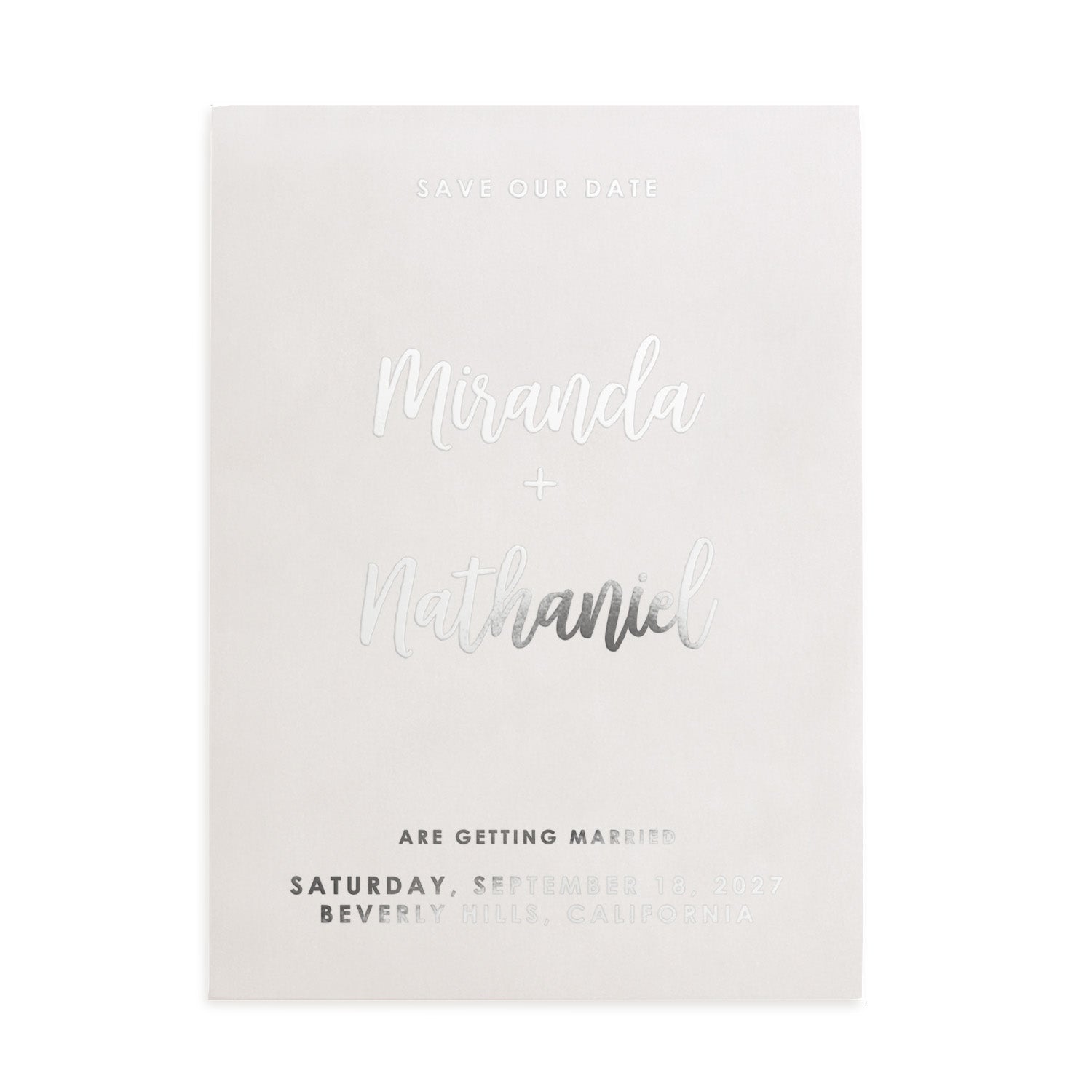 Modern vellum Save the Date card printed in silver foil, styled in warm sunlight among florals and natural textures – XOXOKristen