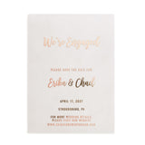 A rose gold printed vellum Save the Date on a white background, showcasing clean typography and shimmering foil for a sleek, minimal presentation - XOXOKristen