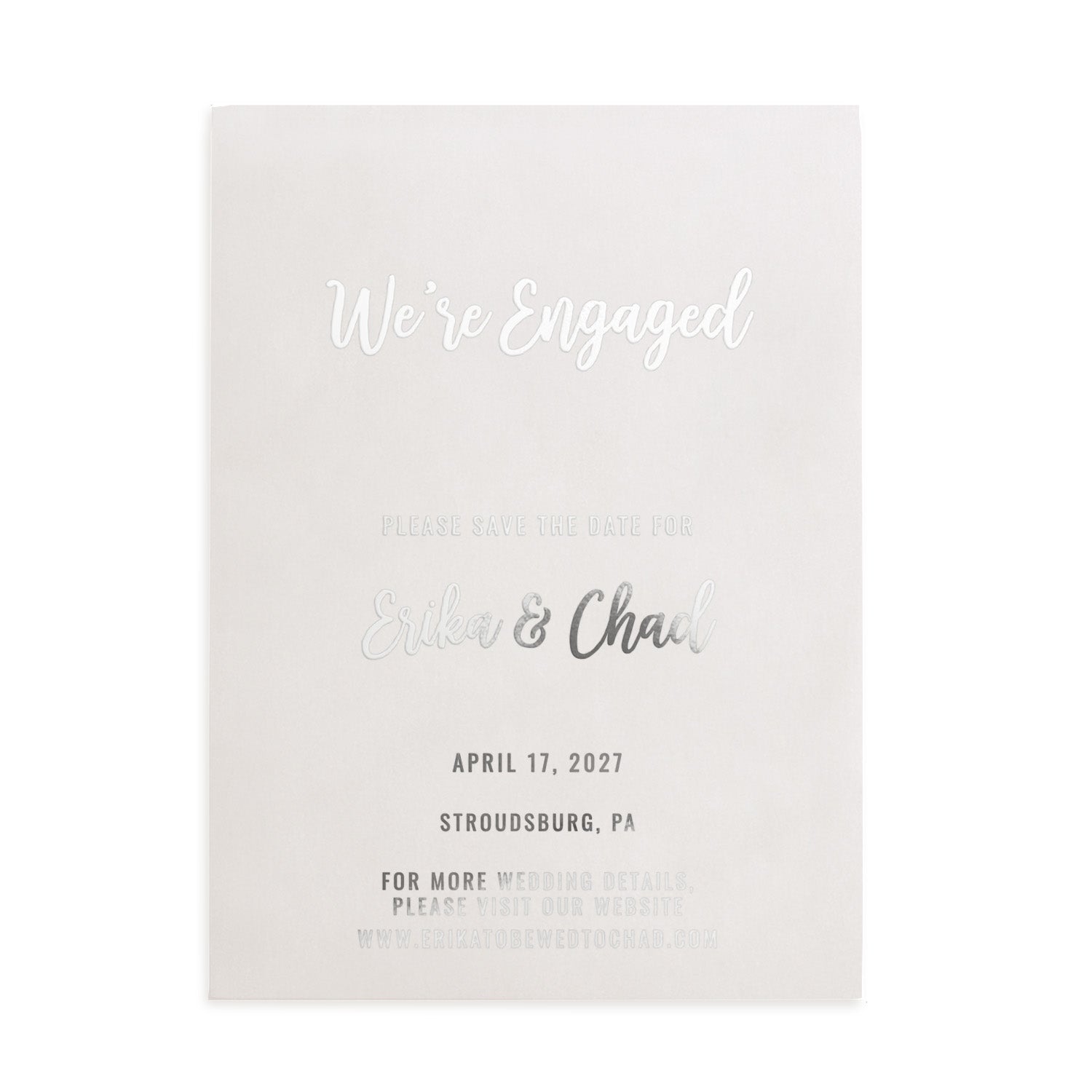 A silver foil version of the engagement Save the Date card photographed against a white backdrop. The metallic finish gives a cool, modern appearance suited for contemporary weddings - XOXOKristen